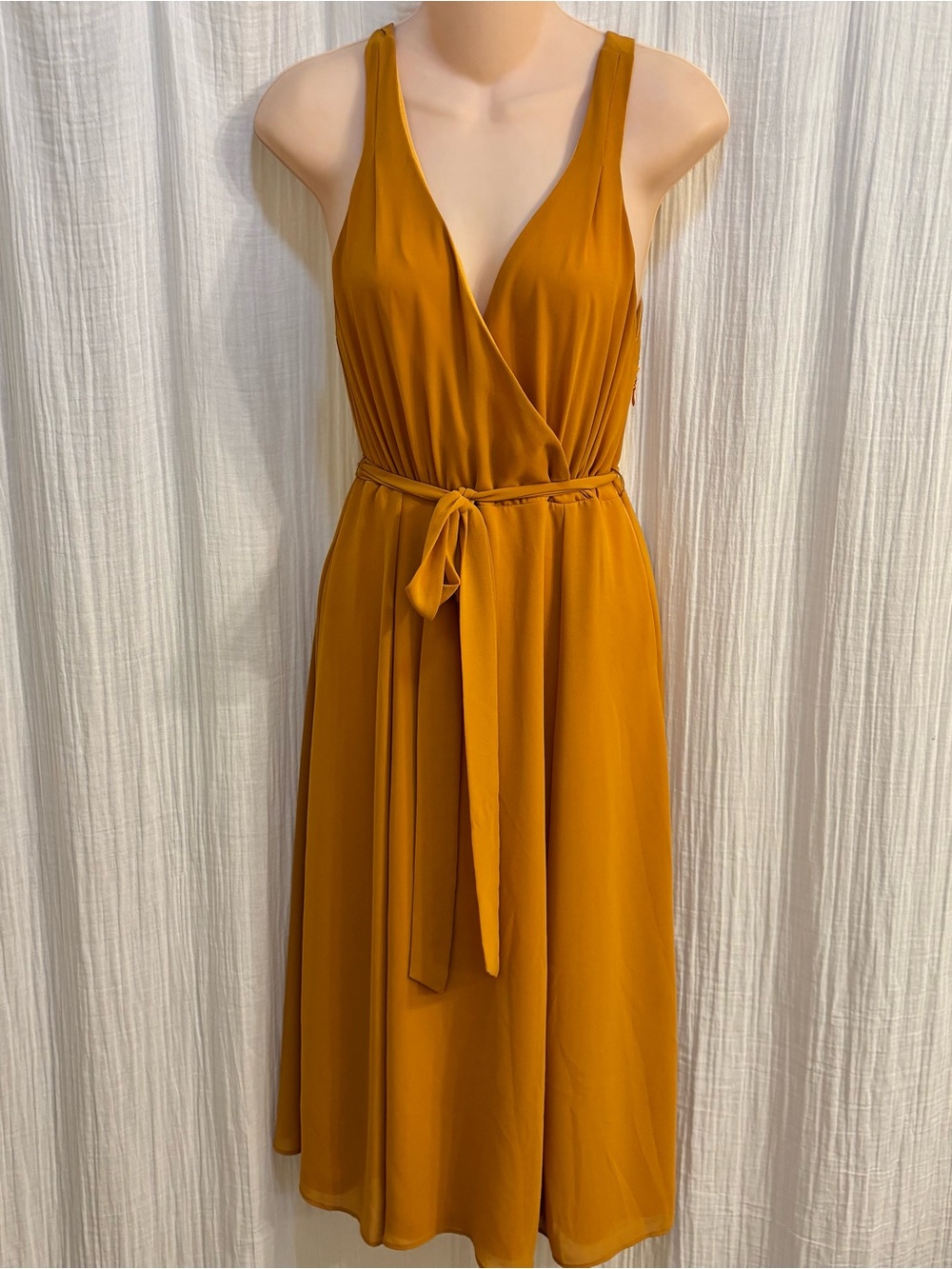 Show Me Your Mumu Cynthia Crossover Dress in a vibrant mustard yellow hue. Small